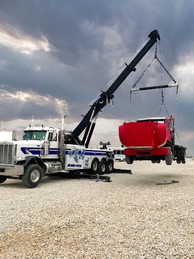 Tow truck lifting red truck 3