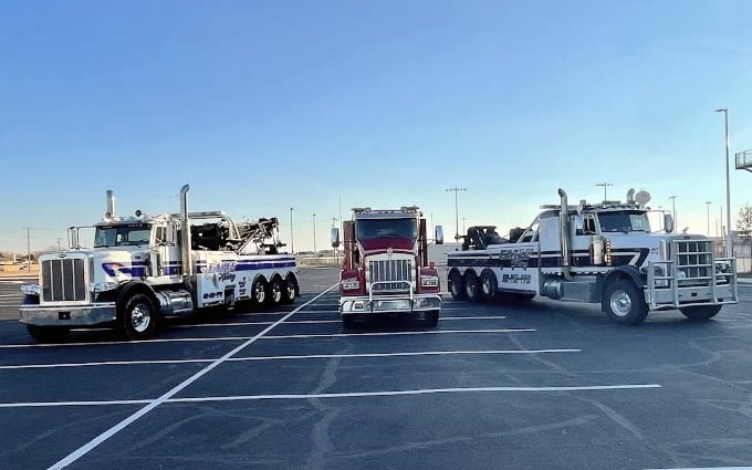 Three eagle tow trucks.